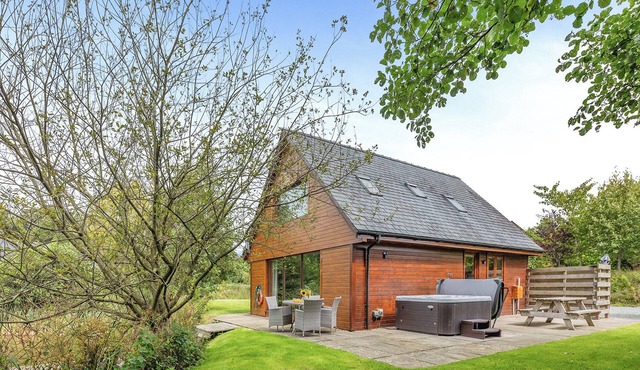 Ground floor: Spacious open plan lounge, kitchen, dining area with log burner.