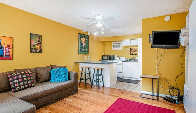 Ground floor studio with WiFi, large kitchenette, partial AC, and great location