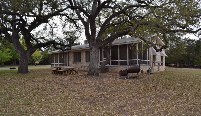 Guadalupe riverfront wooded Hill Country acreage located in Downtown Hunt, TX