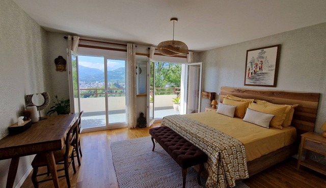 guest room overlooking the town of Lourdes and splendid view of the Pyrenees