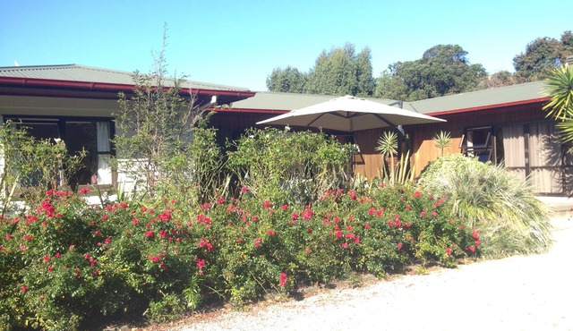 Guest wing in beautiful sheltered garden close to beach
