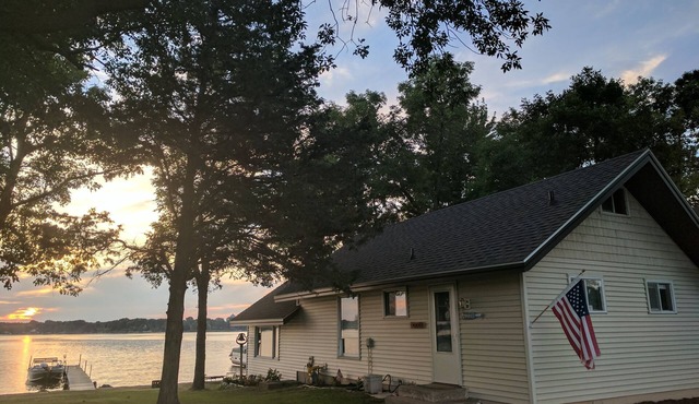 Hamptons style Lake house on Sunset point. With water on both the east and west!