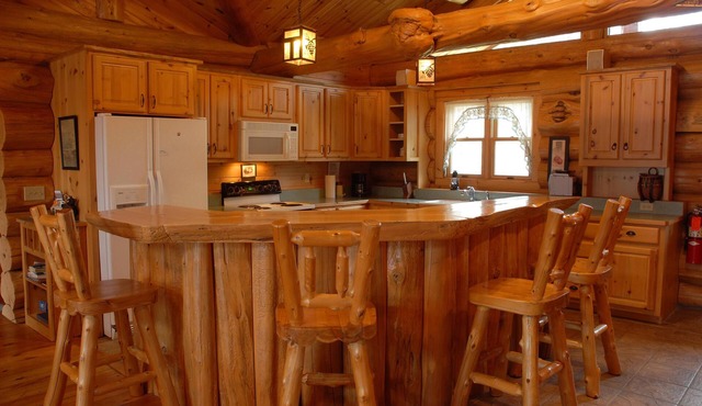 Handcrafted log lodge on Minnesota’s clearest lake. Nestled in the woods.