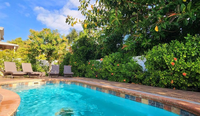 Handicap accessible house one minute from a beach with a heated pool.