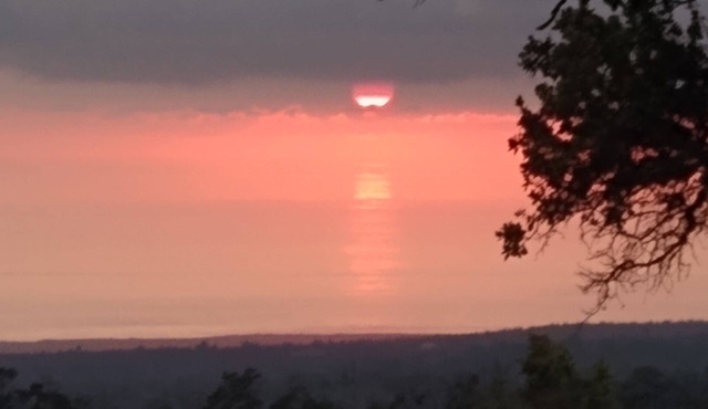 Hawaiian home with incredible ocean views, orchids, and gorgeous sunsets