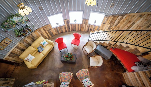 Hermann Grain Bins BNB and Retreat Center Guest Grain Bin Foghorn Leghorn is a 2 story 30 plus foot grain bin with two distinct levels. Main level contains two queen beds, living room and full bathroom. Balcony Level contains queen bunk bed and ful