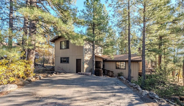 HIDDEN VISTA: Distance views from private oversized deck nestled in cool pines.