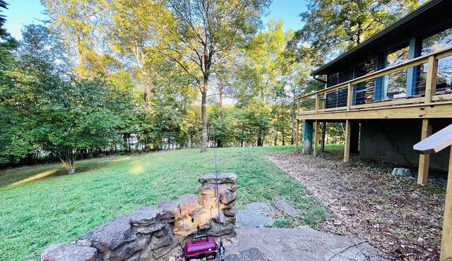 Hideaway on the lake; large mid-century stone ranch in a park-like setting