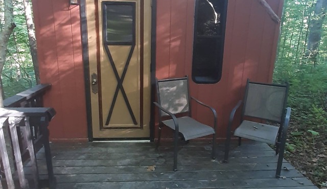 Hike to your tiny cabin in the woods, we will leave the solar lights on for you.