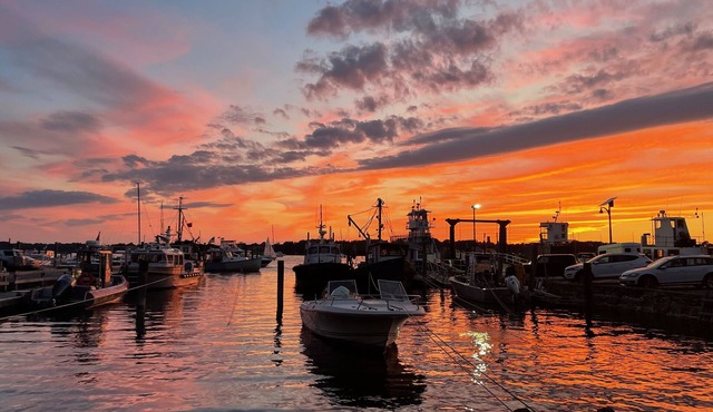 Historic Bristol Harbor Waterfront with Sunsets over Harbor