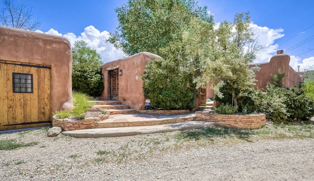 Historic dog-friendly hacienda with 2 casitas, fireplaces, on-site hot tub, yoga