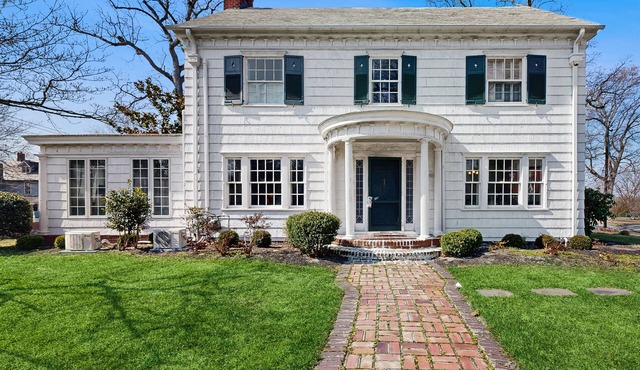 Historic dog-friendly home with a grassy yard, deck, washer/dryer, & central AC