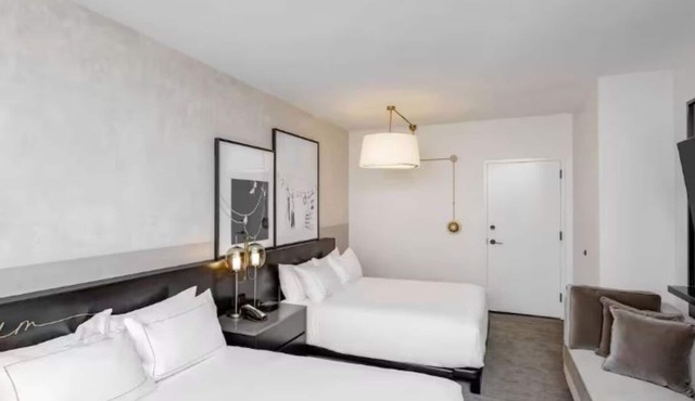 Historic Downtown Hotel Near Wells Fargo Arena, Dining, and Entertainment