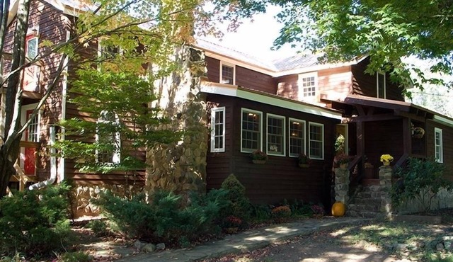 Historic Farmhouse and horsefarm with trail riding and a pond.