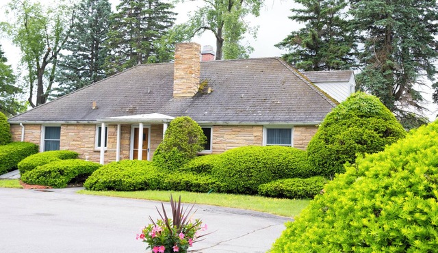 Historic Gate Lodge lovingly renovated and fully furnished in quaint Akron