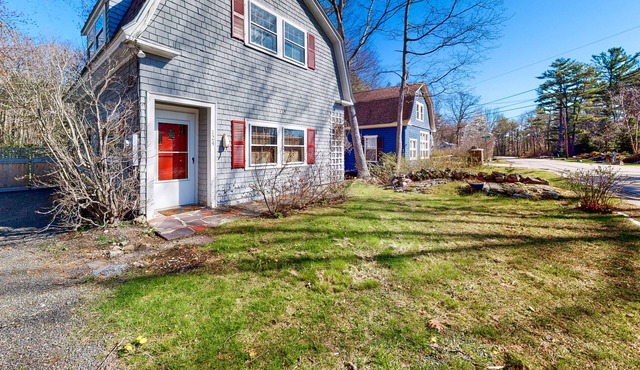 Historic hideaway near the water with a spacious deck, beach gear, & firepit