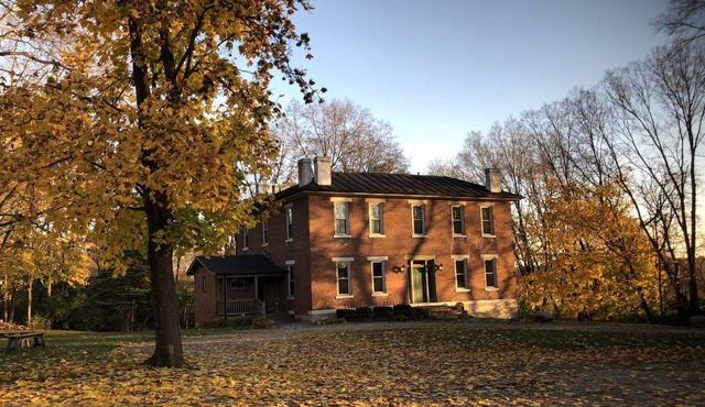 Historic home (circa 1834) on 18 acre country setting with 2 story balcony