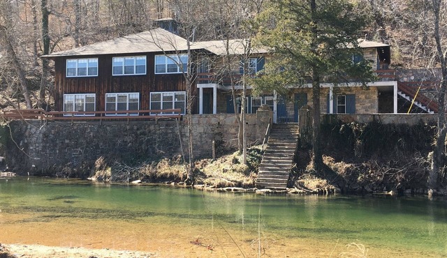 Historic Limestone House in park setting in Ozarks