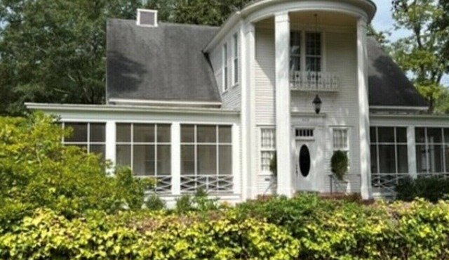 Historic mansion perfect location near downtown Magnolia with screened porch