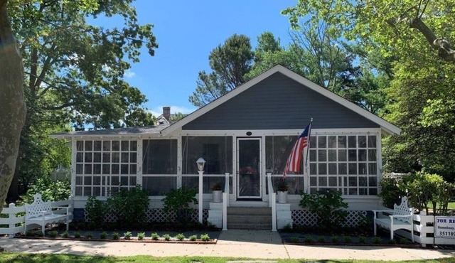 Historic Pines Cottage Sleeps 10 – Walk to Beach, Porch, Patio, and Charm!