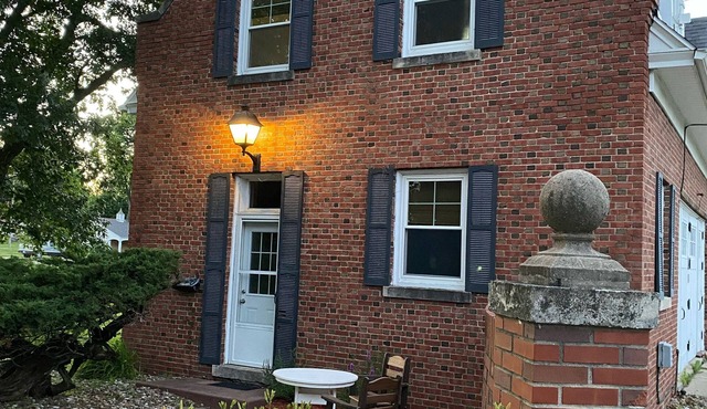 Historic Steckel carriage house with picturesque landscaping