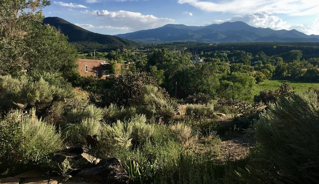 Historic Taos Adobe Overlooking Lush Valley