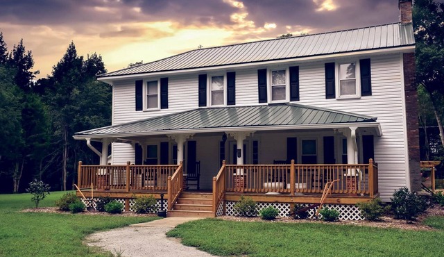 Historical 4 bedroom farmhouse located creek-side on 3 acres of beautiful nature