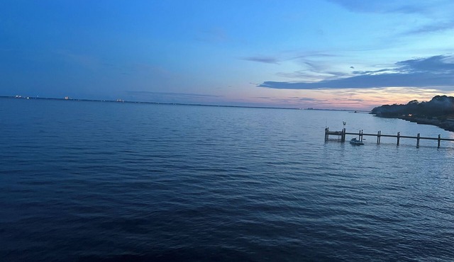 Historical converted tavern surrounded by water, fabulous views, private dock.