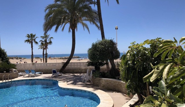 Holiday Apartment 'Front Line on the Beach' with Sea View, Pool, Garden & Wi-Fi