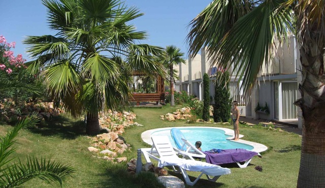Holiday apartment with beautiful garden and various pools