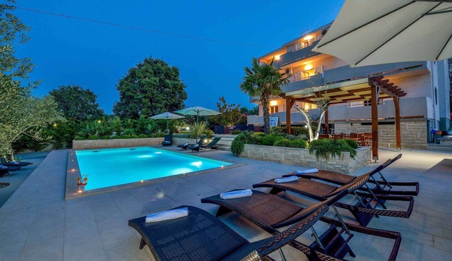 Holiday apartment with sea view and pool
