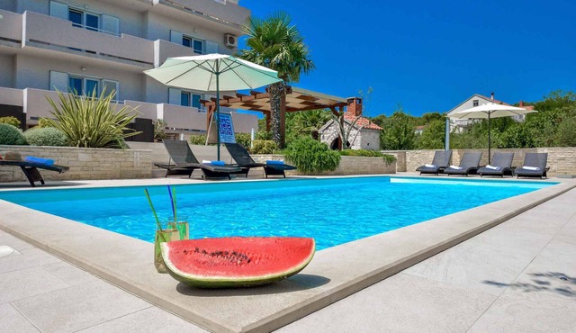 Holiday apartment with children's playground and pool