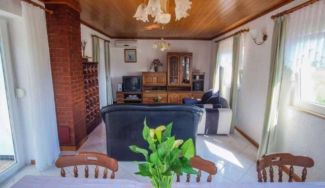 Holiday apartment with terrace and air conditioning