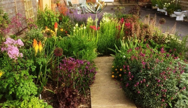 Holiday cottage in rural setting within quiet coastal village.