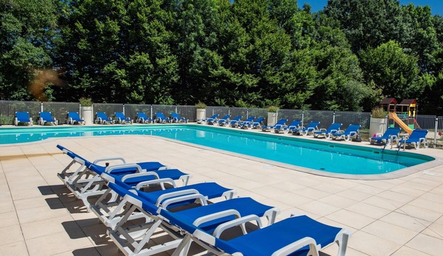 Holiday home in a park with a pool on the lot