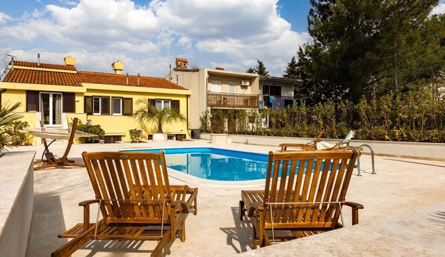 Holiday home with outdoor pool, air conditioning and sea view