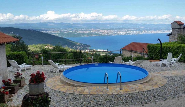 Holiday home with sea view and pool