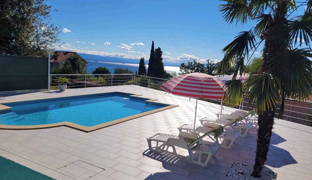 Holiday home with sea view and pool