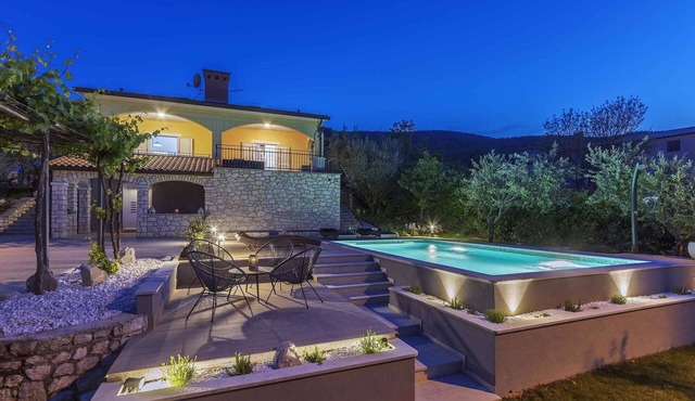 Holiday home with swimming pool, terrace and sea view