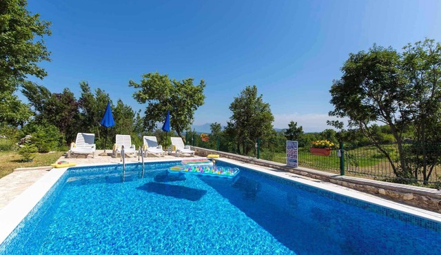 Holiday home with swimming pool surrounded by nature