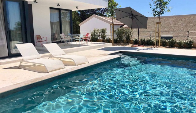Holiday home with terrace and pool
