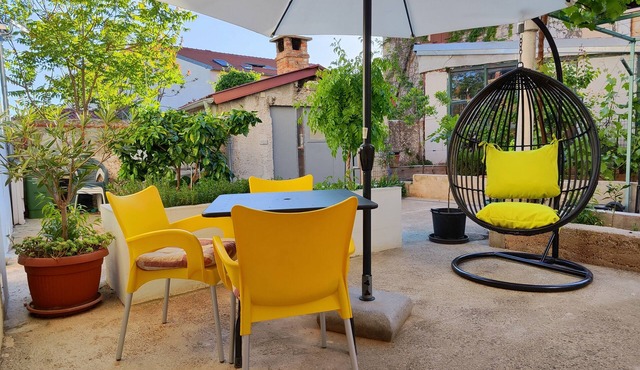 holiday house located in the very center of city in a quiet street with a yard.
