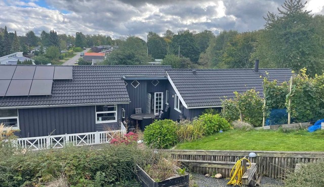 Holiday oasis with terrace and sloping garden