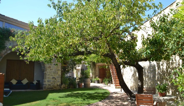 Holidays in Lagrasse. Stunning medieval apartment set in walled garden with pool
