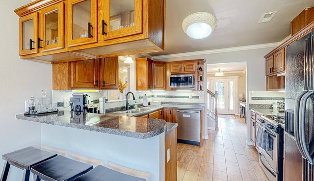 Home in great location with fenced yard, fireplace, bikes, grill, patio, dogs OK
