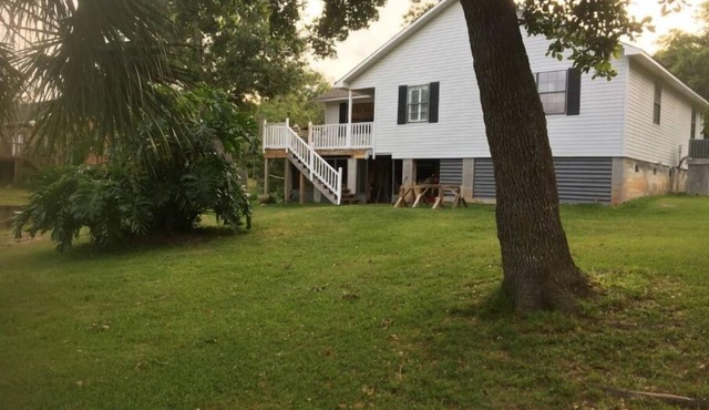 Home just off East Fowl River on deep water canal