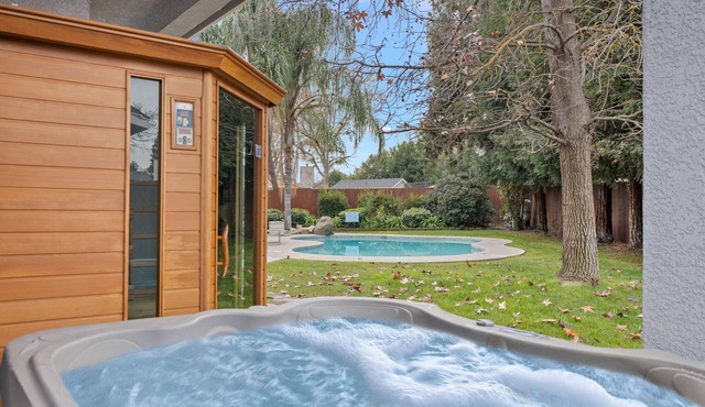 Home oasis with sauna, jacuzzi, pool & heated gazebo!