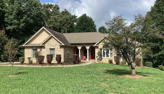 Home on secluded 5 acres with private dock on TN river 100 yards from house.