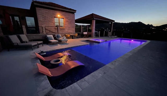 Home with lap pool, hot tub, and wonderful views