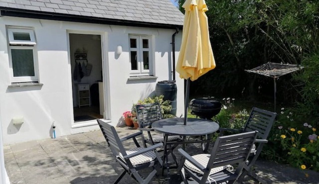 Honeysuckle Cottage with optional hot tub and shared EV charger.